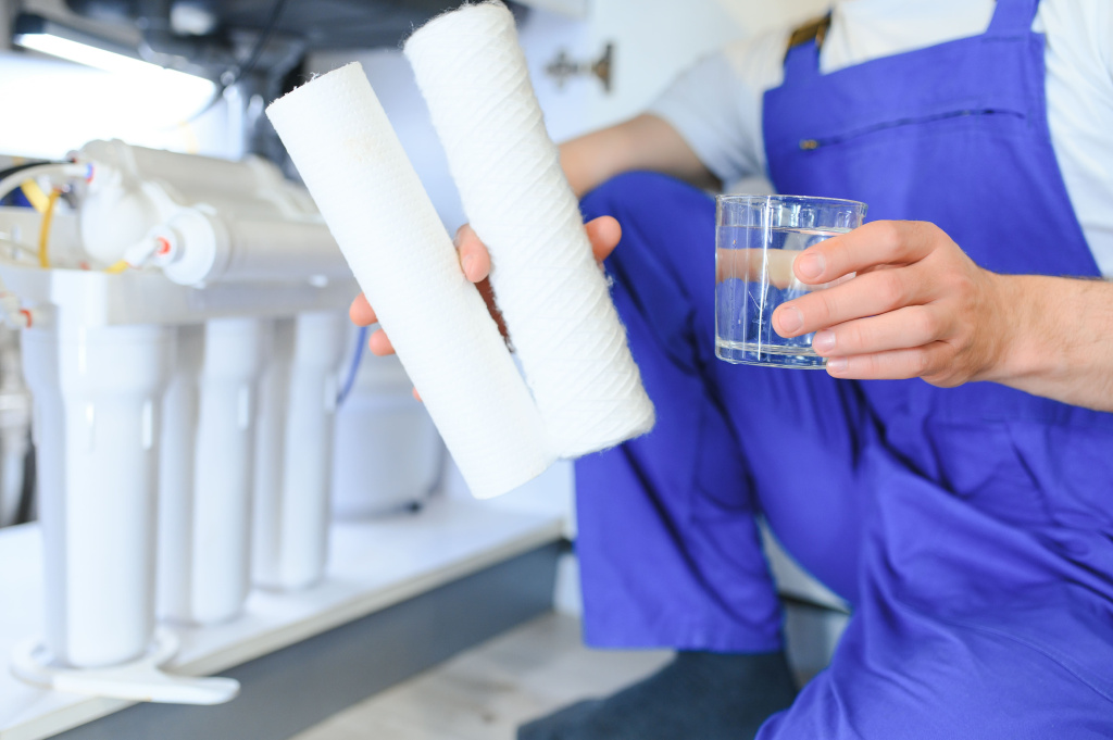 plumber-installs-change-water-filter-replacement-aqua-filter-repairman-installing-water-filter-cartridges-kitchen-installation-reverse-osmosis-water-purification-system.jpg